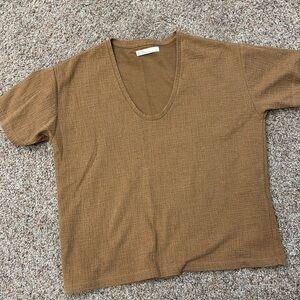 Short sleeve tee with deep scoop neck. Size small. Dark tan color.